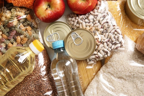 Preview: Many different products on table, top view. Food donation