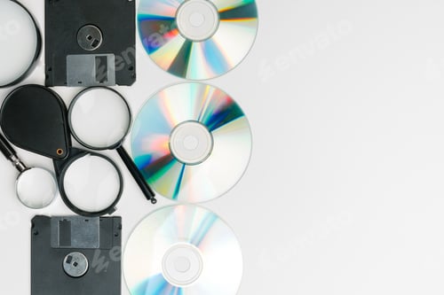 Preview: magnifying glass inspecting on floppy disk concept