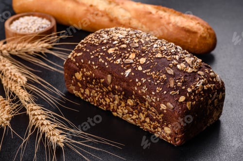 Preview: Fresh Bread on black background, top view, copy space