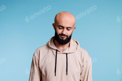 Preview: Arab man looking down