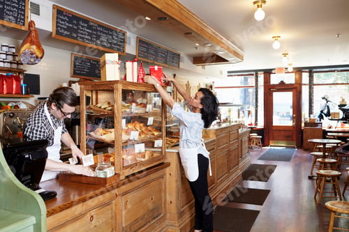 Preview: Male and female workers in bakery going about business