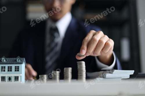 Preview: Real estate agent or investor planning for property investment.