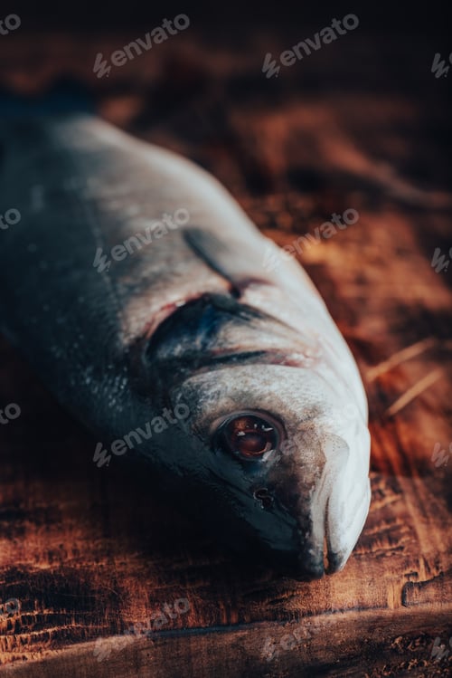 Preview: Fresh Sea Bass on Cutting Board