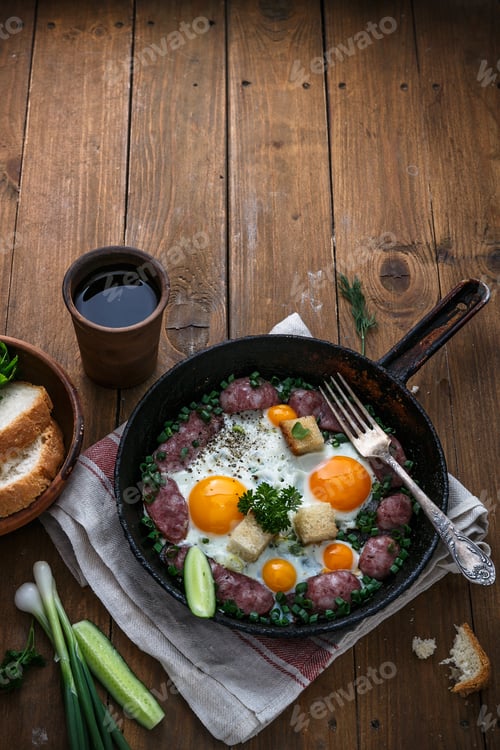 Preview: Sunny side egg with sausage for the breakfast, copy space