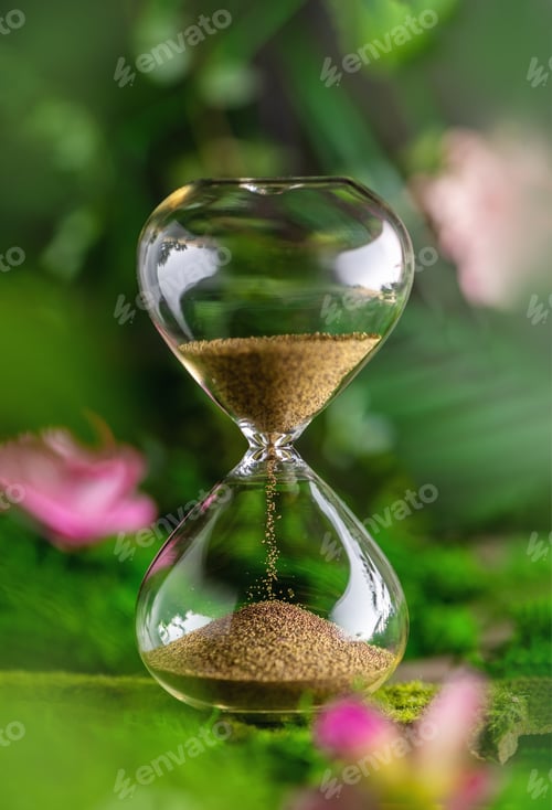 Preview: hourglass. flowers, leaves. concept of time, the onset of spring summer, season