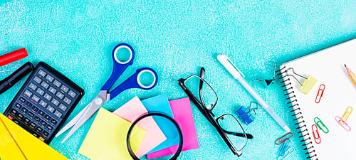Preview: Different school supplies on blue background. Concept Back to school