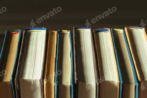 Preview: Books close up on old wooden table