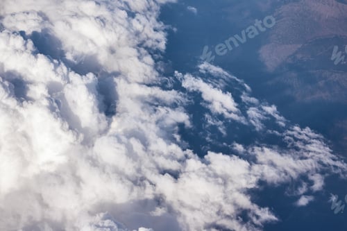 Preview: Blue cloudy sky, view from the airplane window. Aerial view of cloudscape