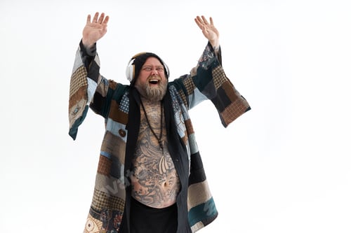 Preview: Fat stylish bearded tattoed caucasian man with big belly is posing and dancing wearing ethnic kimono