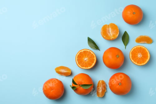 Preview: Ripe sweet mandarins on blue background, top view