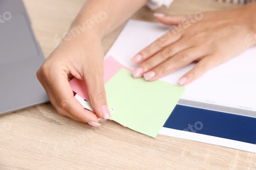 Preview: Business planning. Woman using calendar at wooden table in office, closeup