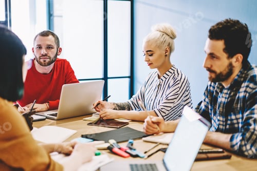 Preview: Diverse team of colleagues working together in office
