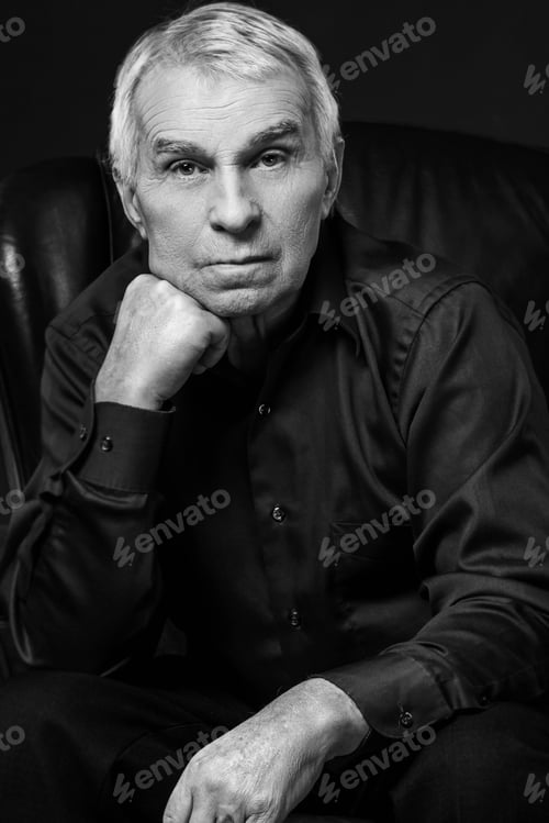 Preview: Monochrome portrait of elderly thoughtful man in studio