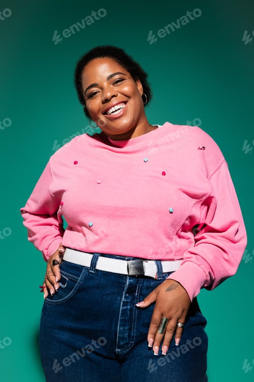 Preview: Chic plus-size African American woman showcases fall fashion in trendy studio