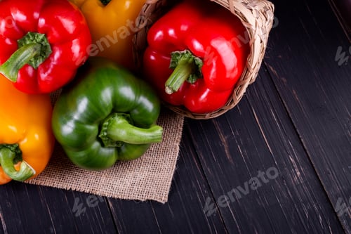 Preview: Three sweet peppers on a wooden background, Cooking vegetable salad
