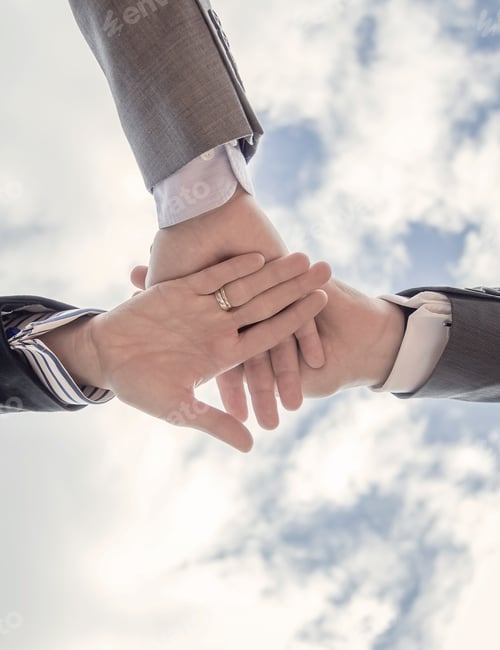 Preview: Business team showing unity with hands together