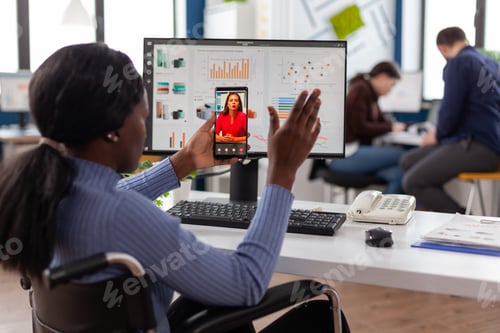 Preview: African american disabled businesswoman greeting remote manager
