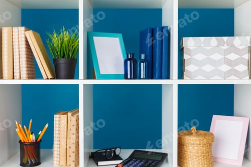 Preview: White office shelves with different stationery, close up