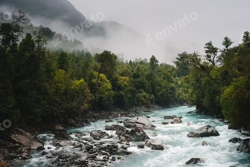Preview: Panoramic shot of flowing water on a river on a foggy forest