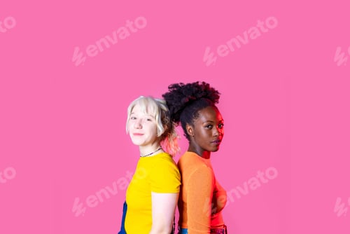 Preview: Two young diverse multicultural caucasian and black women best friends posing