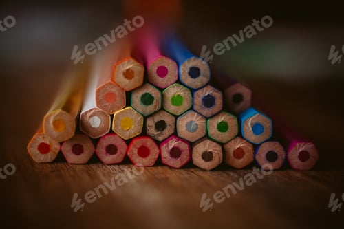 Preview: Colored pencils on wooden background with selective focus. Back to school and education concept.