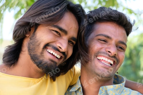 Preview: Portrait of two cheerful Indian friends in an outdoor place