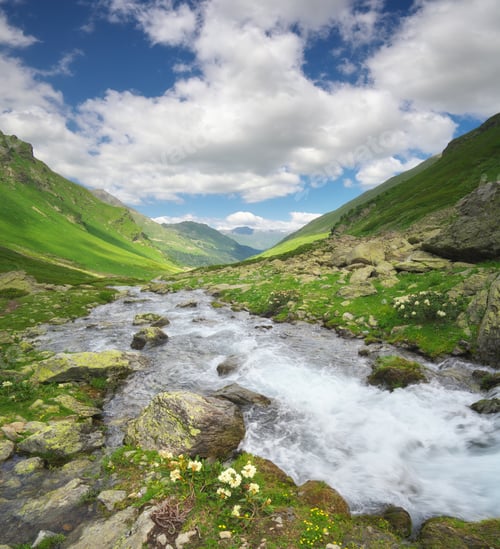 Preview: River in mountain valley at day.