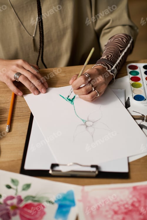 Preview: Young woman creatively painting in her modern apartment with vibrant artistic flair