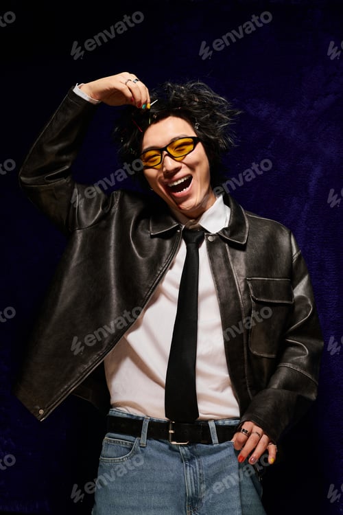Preview: Spring fashion: an Asian man in a studio showcasing playful styles