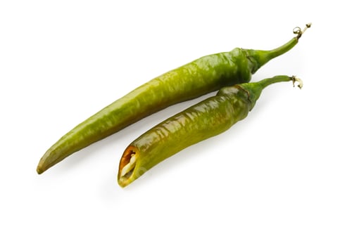 Preview: Green chili peppers closeup isolated on white background
