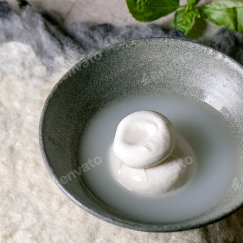 Preview: Traditional italian burrata knotted cheese in bowl