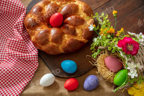 Preview: Easter Greek tsoureki braid overhead. Sweet bread brioche on table, checked red tablecloth