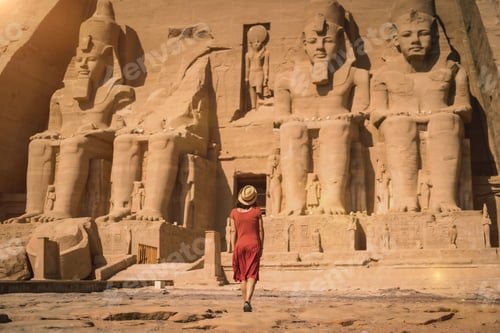 Preview: A young tourist in a red dress entering the Abu Simbel Temple in southern Egypt