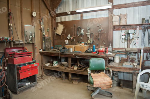 Preview: Wide shot of an old barn' s workbench with different types of tools