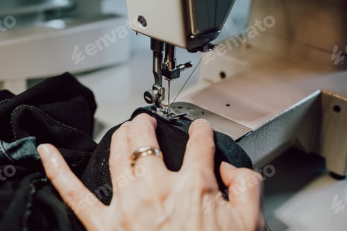 Preview: woman sews on the sewing machine