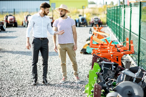 Preview: Agronomist with salesman at the agricultural shop