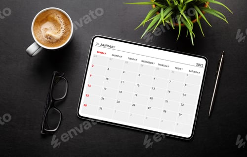 Preview: Tablet with calendar app, coffee cup and office supplies
