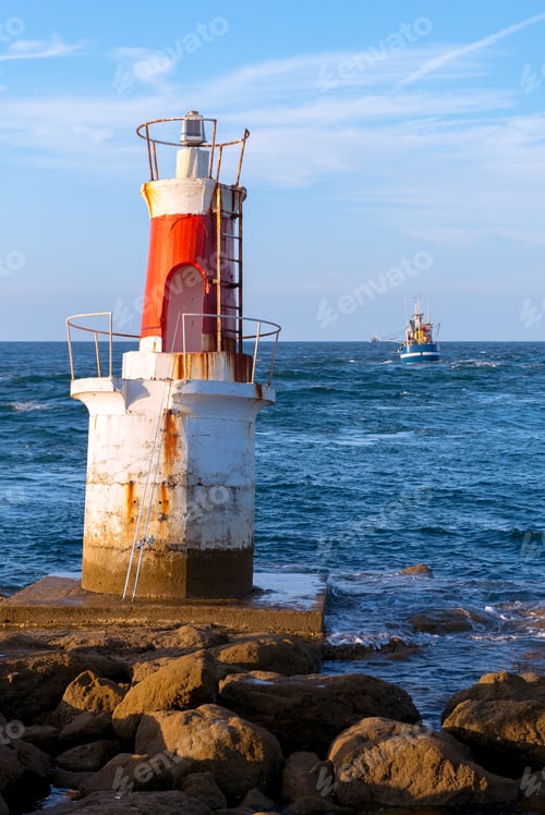 Preview: Lighthouse on rocky coastline