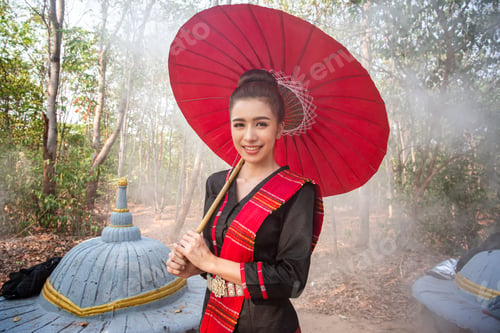 Preview: Woman with a parasol standing in front of an elephant, Thailand