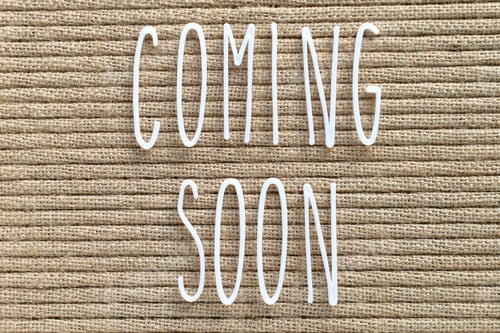 Preview: Coming Soon - white skinny letters on a burlap background, boho farmhouse chic style