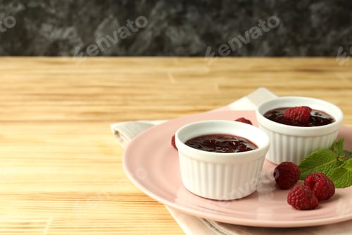 Preview: Concept of tasty food with raspberry jam on wooden table