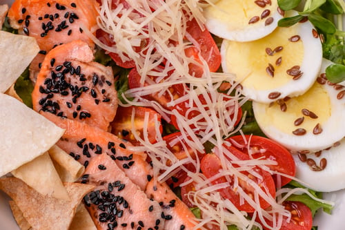 Preview: Delicious fresh caesar salad with salmon, lettuce, tomatoes and egg
