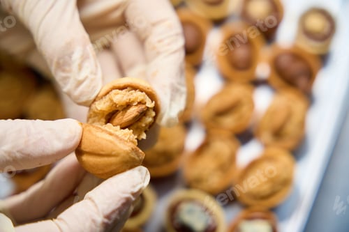 Preview: Skilled baker preparing shortbread homemade sweet nuts