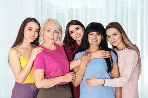 Preview: Group of ladies near window indoors. Women power concept