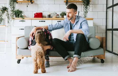 Preview: Father and Child Sitting Together at Home with Dog