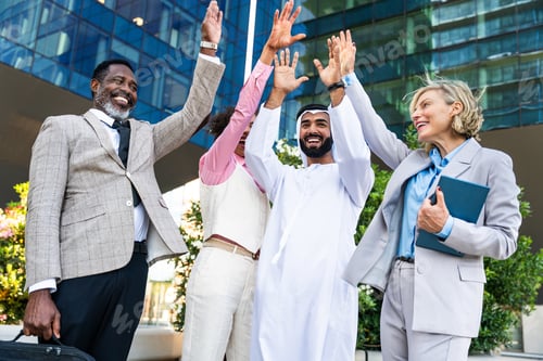Preview: Group of multiethnic business people meeting an emirati businessman