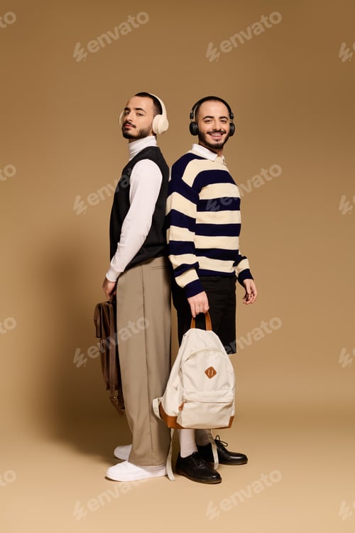 Preview: Stylish twin brothers pose confidently with trendy accessories in a warm, inviting setting