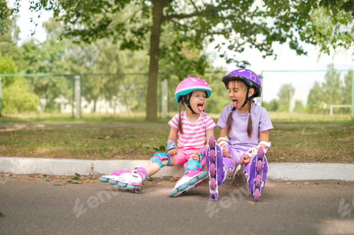 Preview: Kids in roller skates are resting on curb of sidewalk, showing each other tongue