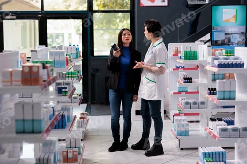 Preview: Drugstore buyer asking pharmacist for dietary supplements usage advice
