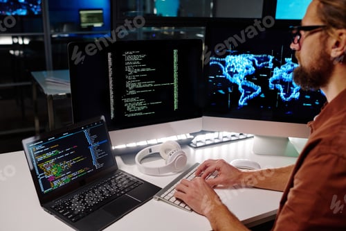 Preview: Close-up of young programmer or software developer decoding data